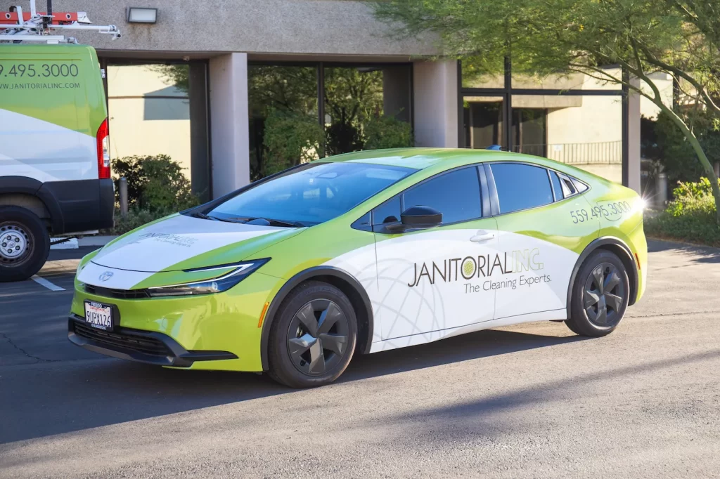 Janitorial Inc. vehicle in parking lot.